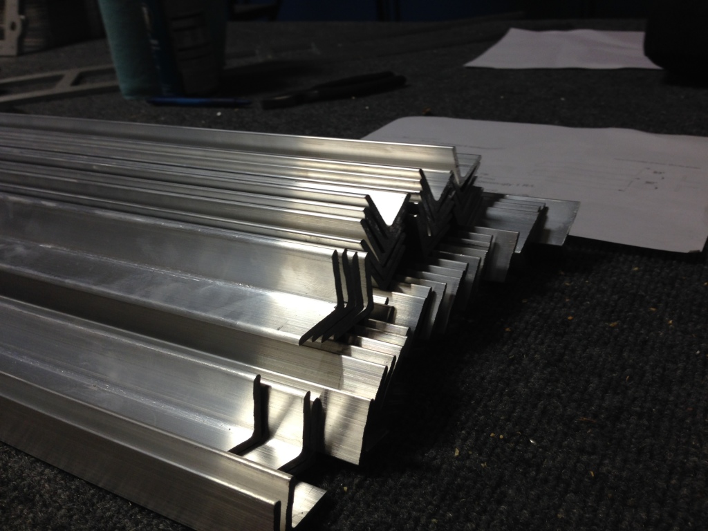 The upper longeron is a stock angle cut to angle and length. The lower is a custom extrusion we designed, also now cut to the exact angle. Earlier kits required the builder to use a compound miter saw to get the angle correct.